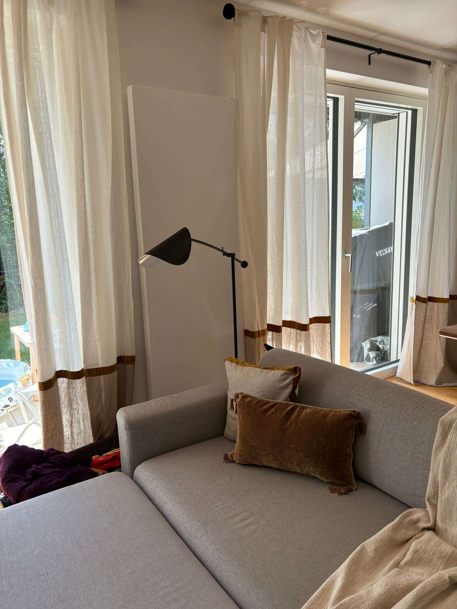 Cozy cushions on the sofa and curtains