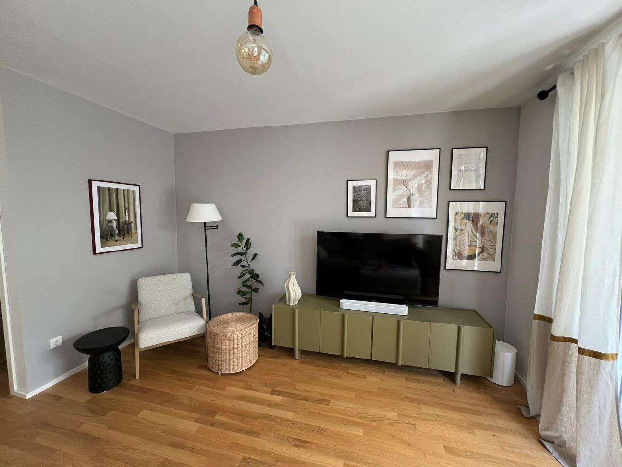 Completed TV area with an olive cabinet